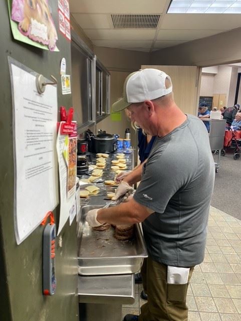 Tim Doyle serving food