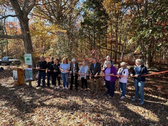 Preparing to cut the ribbon at the dedication of Franklin Indian Branch Preserve