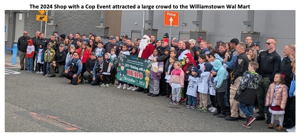 Crowd of children and cops waiting to shop at Wal Mart