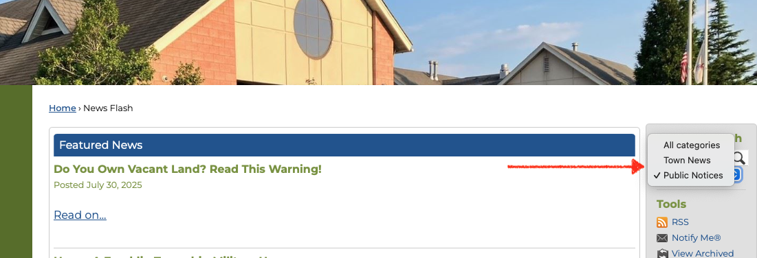 Arrow indicating pull down menu for town news and public notices